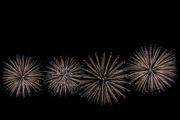 Beautiful abstract pattern with salute fireworks on dark background.
