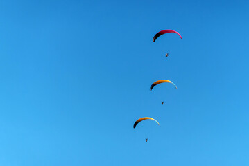 paraglider in the blue sky