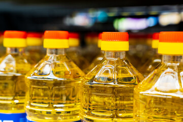 Sunflower oil. The neck of a plastic bottle. Grocery department in a store or market. Background