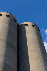 big grain silos with windows on top