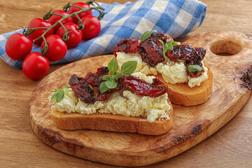 Bruschetta with soft cheese and tomato
