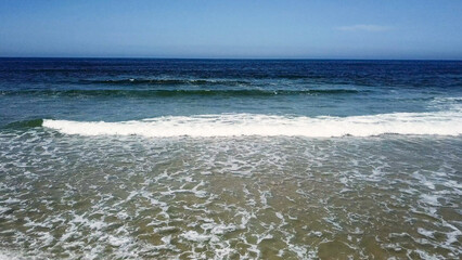 Ocean waves crashing on beach