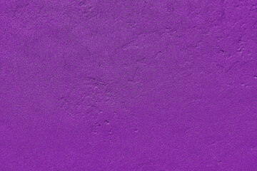 Purple wall plaster texture background. Wall texture with a rough plaster pattern