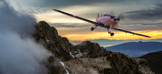 Fototapeta na wymiar Small Airplane flying in the Mountains. Canadian Landscape Nature Background.