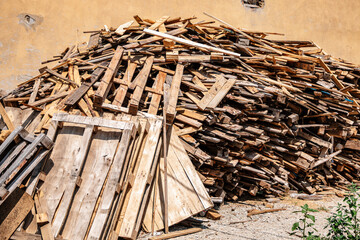 a pile of discarded wooden boards
