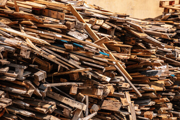 a pile of discarded wooden boards