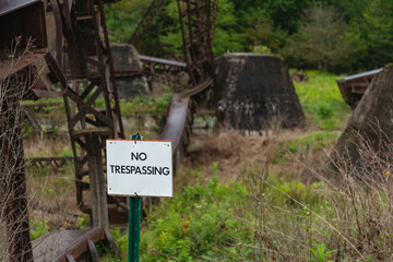 Fallen steel bridge no trespassing sign danger keep out, copy space design image 