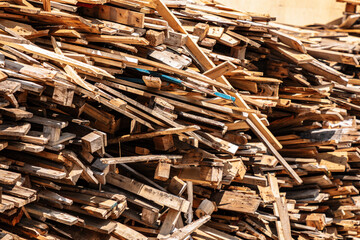 a pile of discarded wooden boards