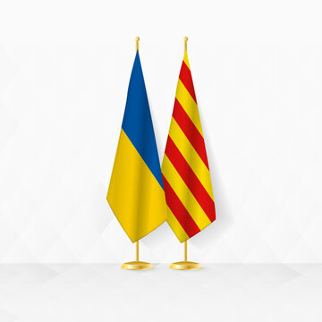 Ukraine and Catalonia flags on flag stand, illustration for diplomacy and other meeting between Ukraine and Catalonia.