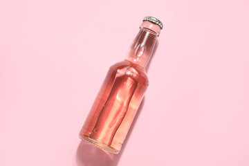 Bottle of fresh soda on pink background - obrazy, fototapety, plakaty
