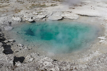 Bright turquoise colored hot spring in Yellowstone
