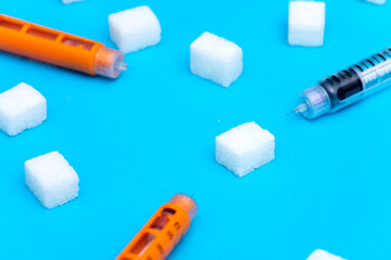 Insulin injection pen on blue background
