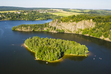 Aerial view of lake Sec with beautiful island. Famous tourist destination in Pardubicky kraj, Czech republic, European union. - obrazy, fototapety, plakaty