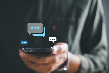 Man smartphone becomes portal for live chat engagement, representing social networking and chatting...