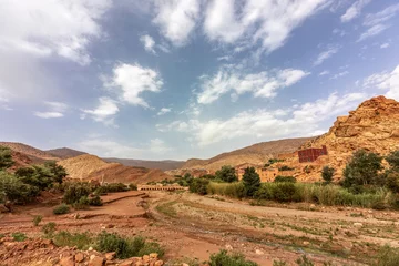 Foto op Plexiglas Landscape impression of the semidesert along the atlas torrent in morocco in summer © Annabell Gsödl