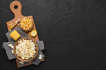 Fototapeta na wymiar Prepared popcorn with ingredients on concrete background, top view