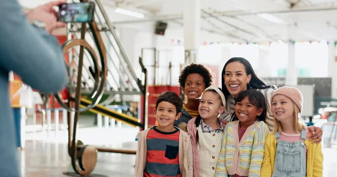 Photo, happy and a woman with children at a science fair for a memory, school exhibition or learning. Smile, together and a teacher with kids or students taking a picture at a museum for education