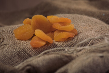  A photo of apricot in styling - apricot - stock photo by Qaisi.dried apricots in a bowl