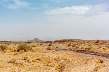 Saharic desert and oasis landscape between Marrakech and Merzouga, Morocco, in summer. Landscape impressions along the Atlas and Anti-Atlas torrent and Wadi Draa Valley