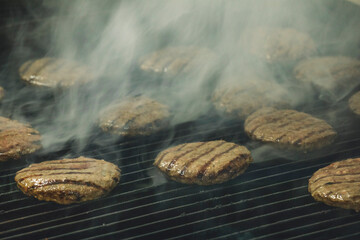 Frying hamburgers on the oven - hamburgers on the gas stove - stock photo of hamburger