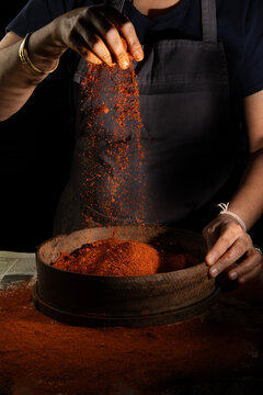 Woman making spice blend 