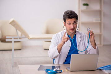 Young male doctor otologist working in the clinic