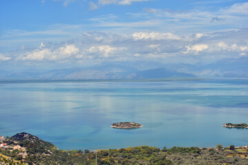Island on the Skadar Lake panorama. Sunny and cloudy summer day travel and holidays photography. Beautiful background scenery.