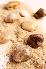 Fototapeta na wymiar Many pebble stones and sand, closeup