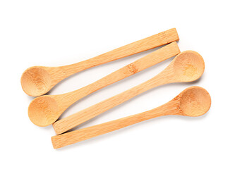 Empty wooden spoons isolated on white background