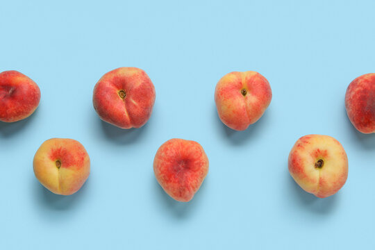 Sweet fig peaches on blue background
