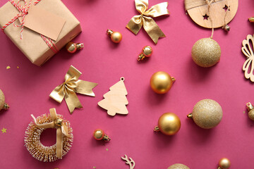 Christmas balls, bow and gift box on purple background