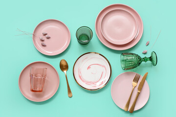 Beautiful table setting on turquoise background