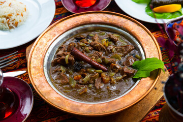 Traditional turkish lamb meat saute mutancana with rice and tea