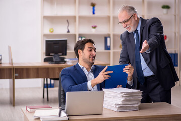Two male colleagues working in the office