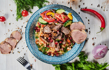 Rice pilaf with lamb meat and vegetables.