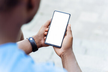 Closeup of african american man hand holding mobile phone with empty display, mockup