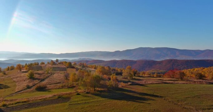 Carpathian mountain village surrounded by high autumn mountains