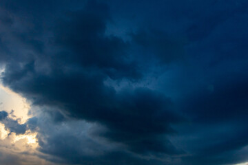 Fototapeta na wymiar big clouds at sunset before the storm