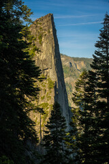 Sentinel Rock Rises Through The Trees Along Four MIle Trail In Yosemite