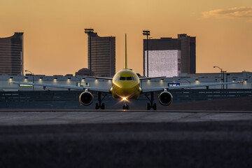 Yellow airplane is preparing for take off in Harry Reid airport in Las Vegas