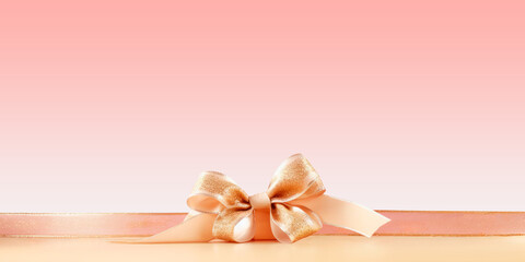 Gift box with ribbon bow and space for text, pastel pink tone on tone