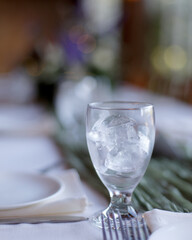 light and airy floral table setting, with whites, tans and greens.