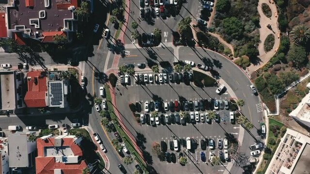 4K drone aerial tracking and stablishing shot of a beach with a pier in California