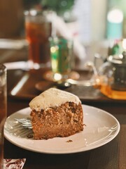 Carrot Cake on a White Plate in a Restaurant