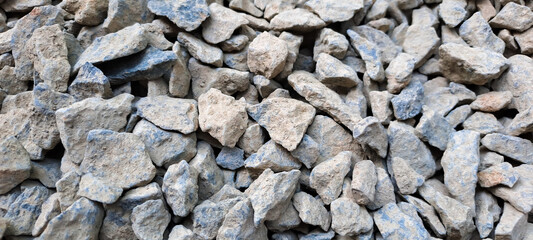 Gravel texture or gravel background for design. Real grunge texture background and small stone.Top view of ground gravel road. selective focus.