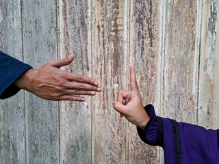 Woman refusing to shake hand of man	
