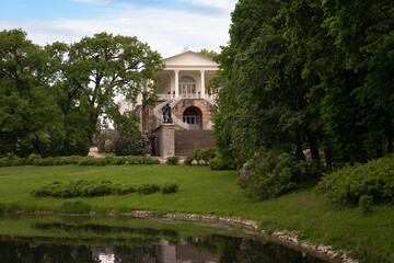 View of the Cameron Gallery on the shore of a large pond in Catherine Park of Tsarskoye Selo on a sunny summer day, Pushkin, St. Petersburg, Russia