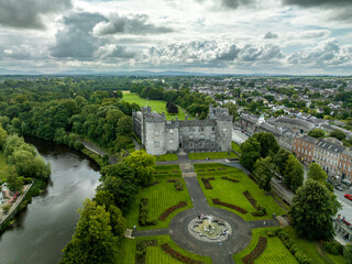 Aerial view of Kilkenny castle, Victorian remodeling of a medieval defensive structure, rolling...
