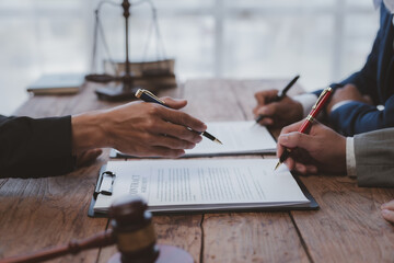 Businessman and lawyer discuss the contract document. Treaty of the law. Sign a contract business.