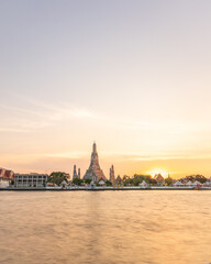 Fototapeta na wymiar Wat Arun Temple during Sunset at Chao Praya River Bangkok, Thailand.